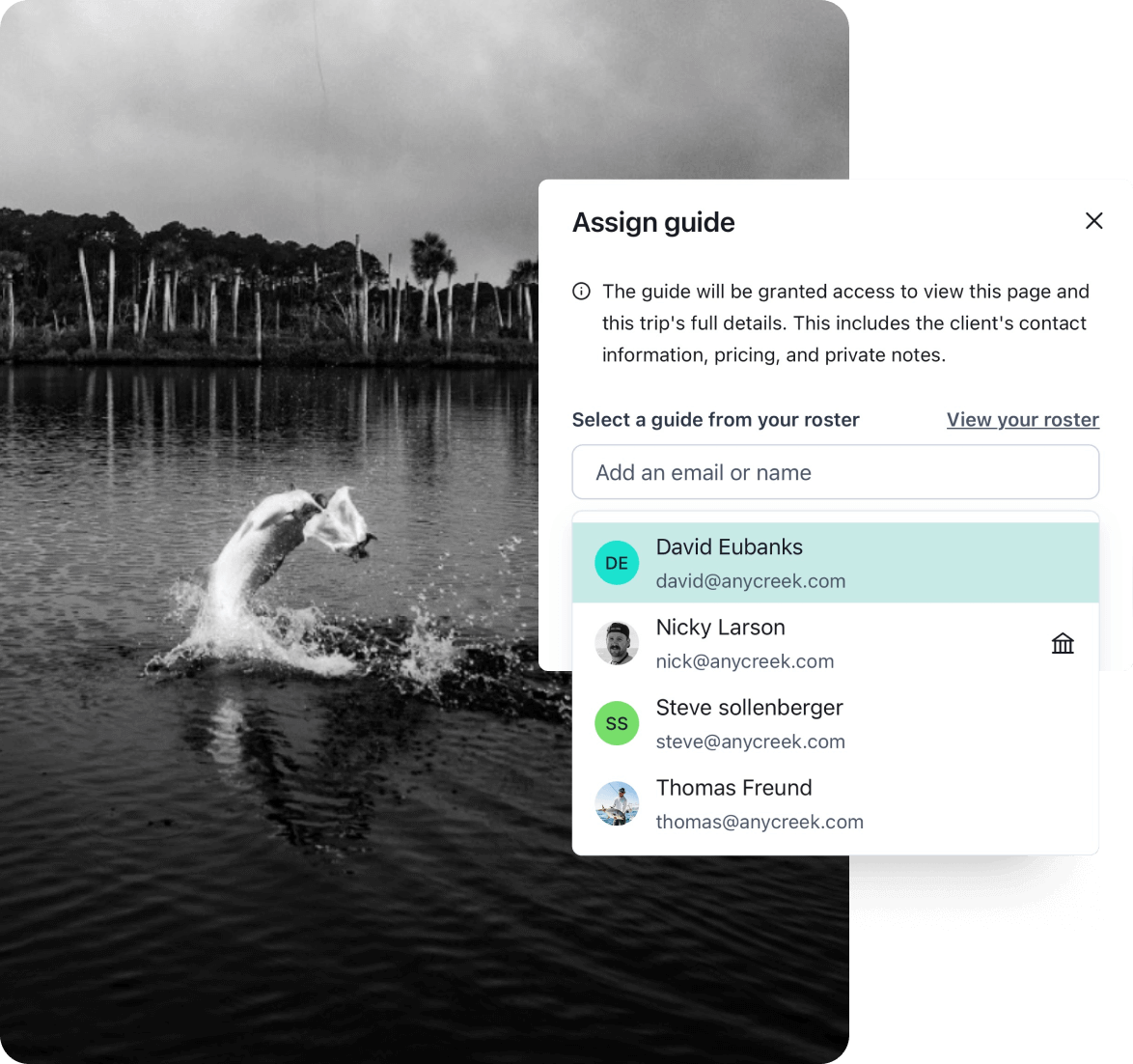 A photo of a large fish jumping out of the water and the AnyCreek "Assign guide" modal